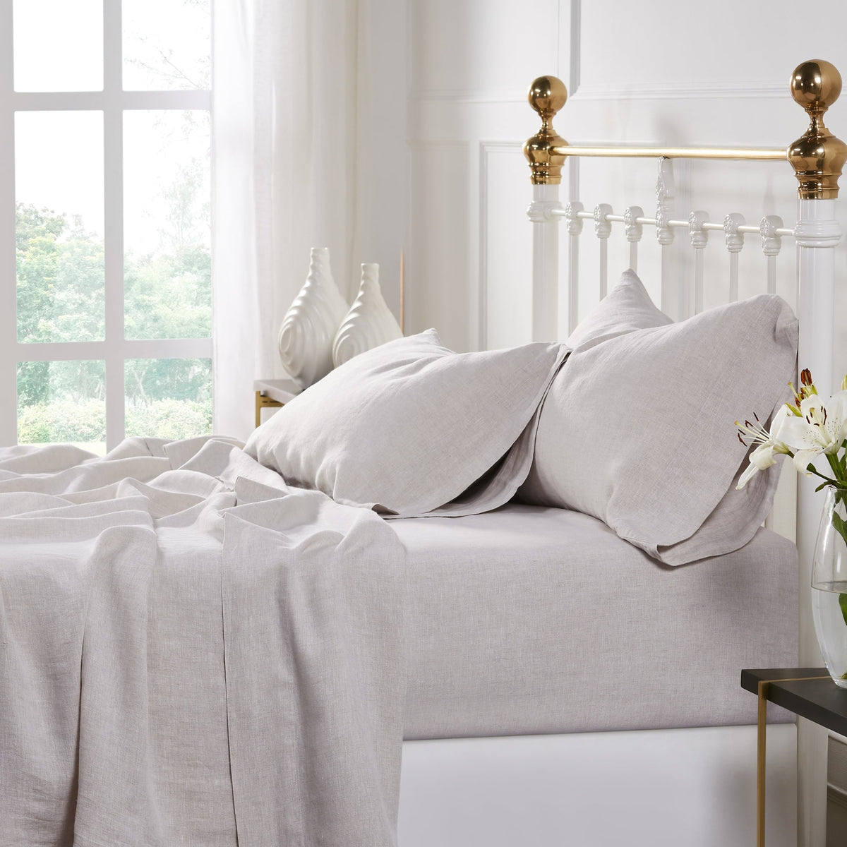 KSS-515-7880_2|Relaxed natural beige 100% pure linen sheets and pillowcases draped on a bed, showcasing softness and natural texture. Eco-friendly.