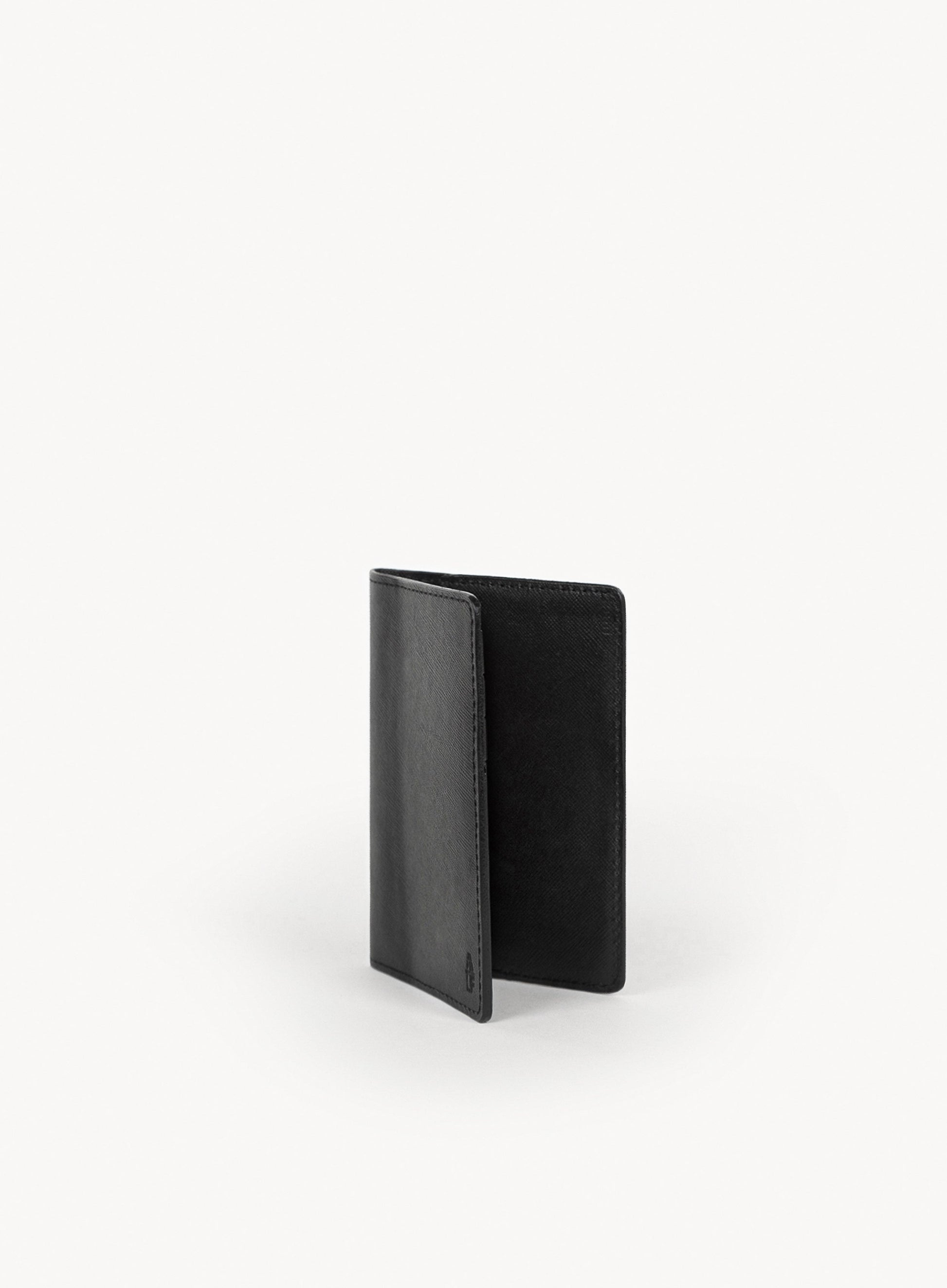 operators passport cover in black side-view.
