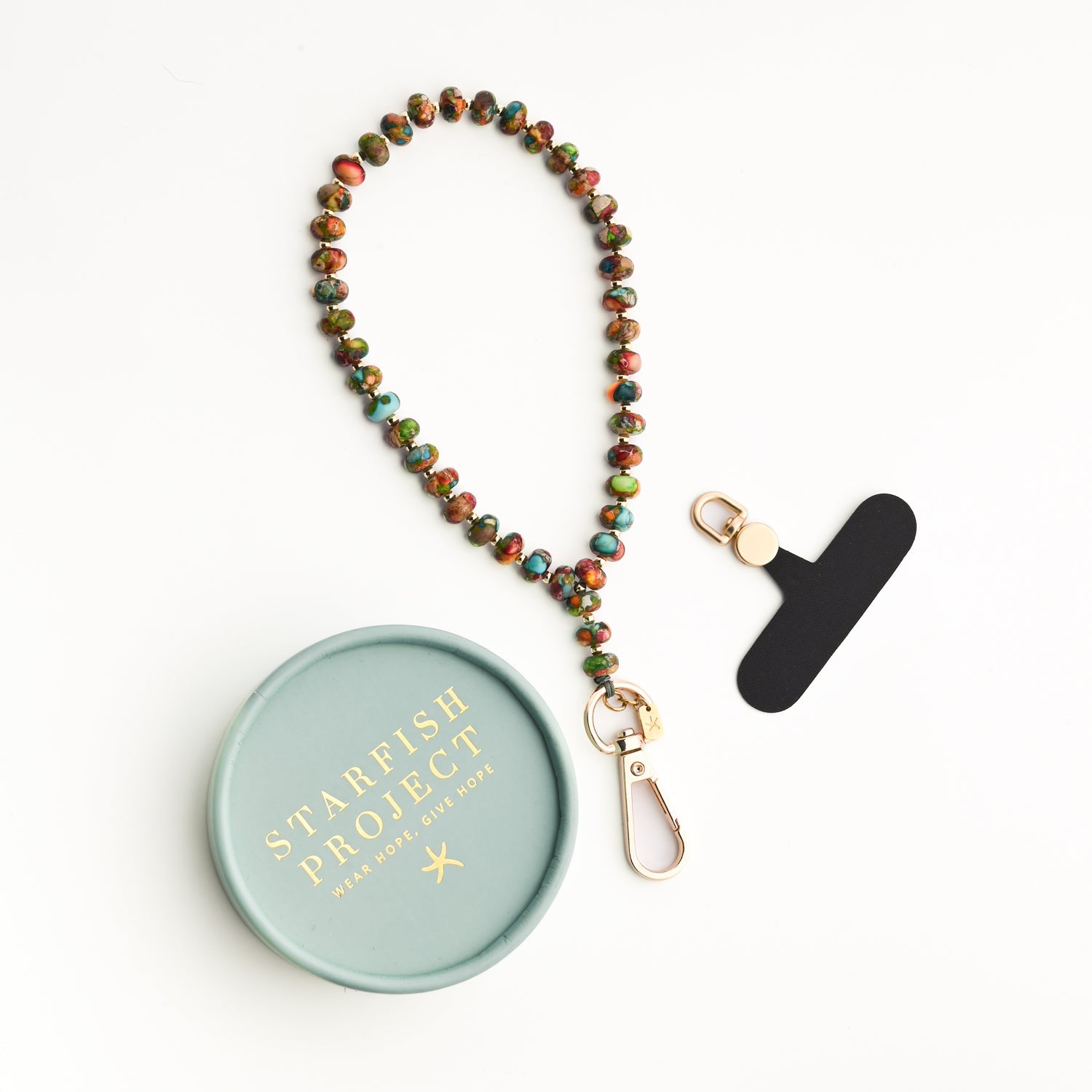 Model showing how to use beaded phone strap, beautiful phone accessory, women's artisan jewelry business