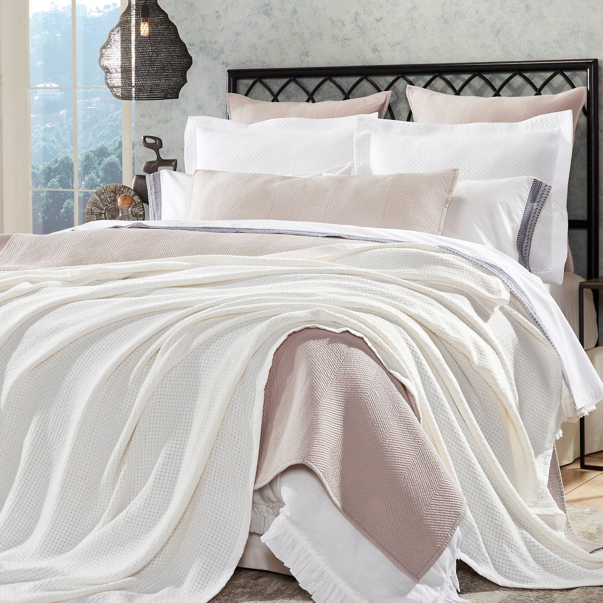 BL-852-9496_1|Draped white waffle weave blanket on a cozy bed with neutral bedding, adding a luxurious texture to bedroom decor.
