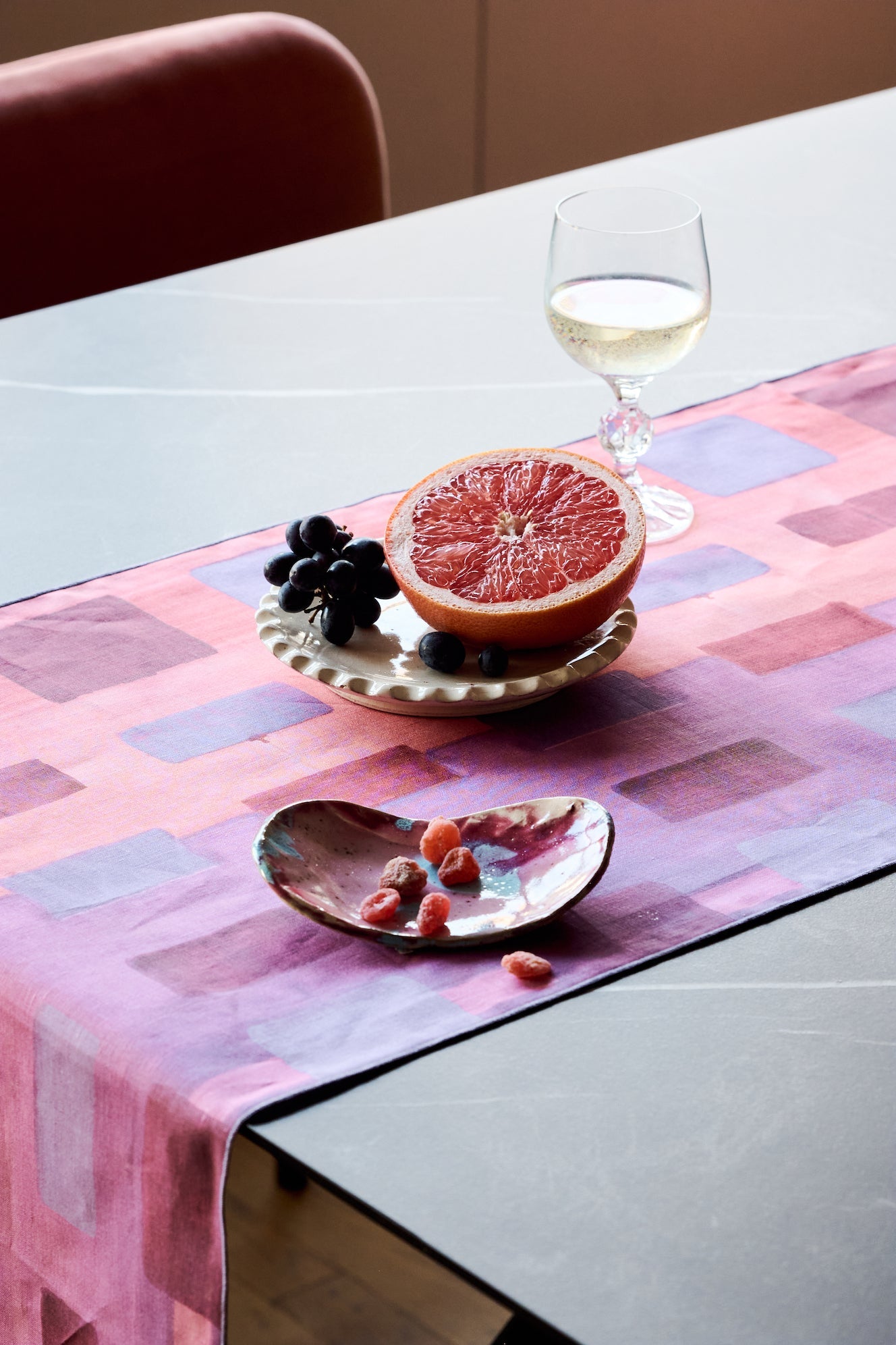 Pink Tapestry linen table runner flat lay close up of abstract brushstroke detail - Goldie Home