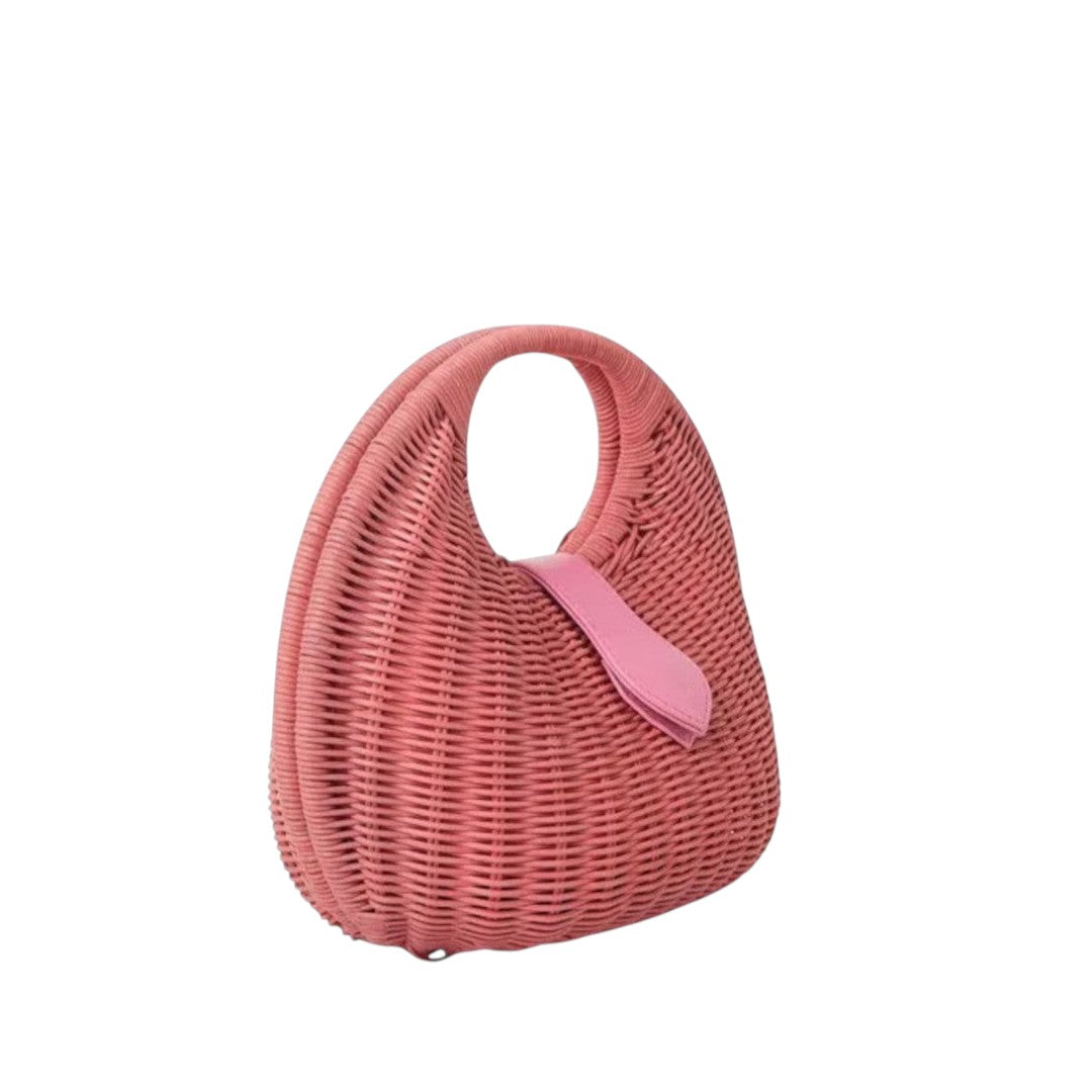 Shop Sarah Stewart Matilda pink wicker handbag with leather strap detail. A modern, relaxed luxury accessory.
