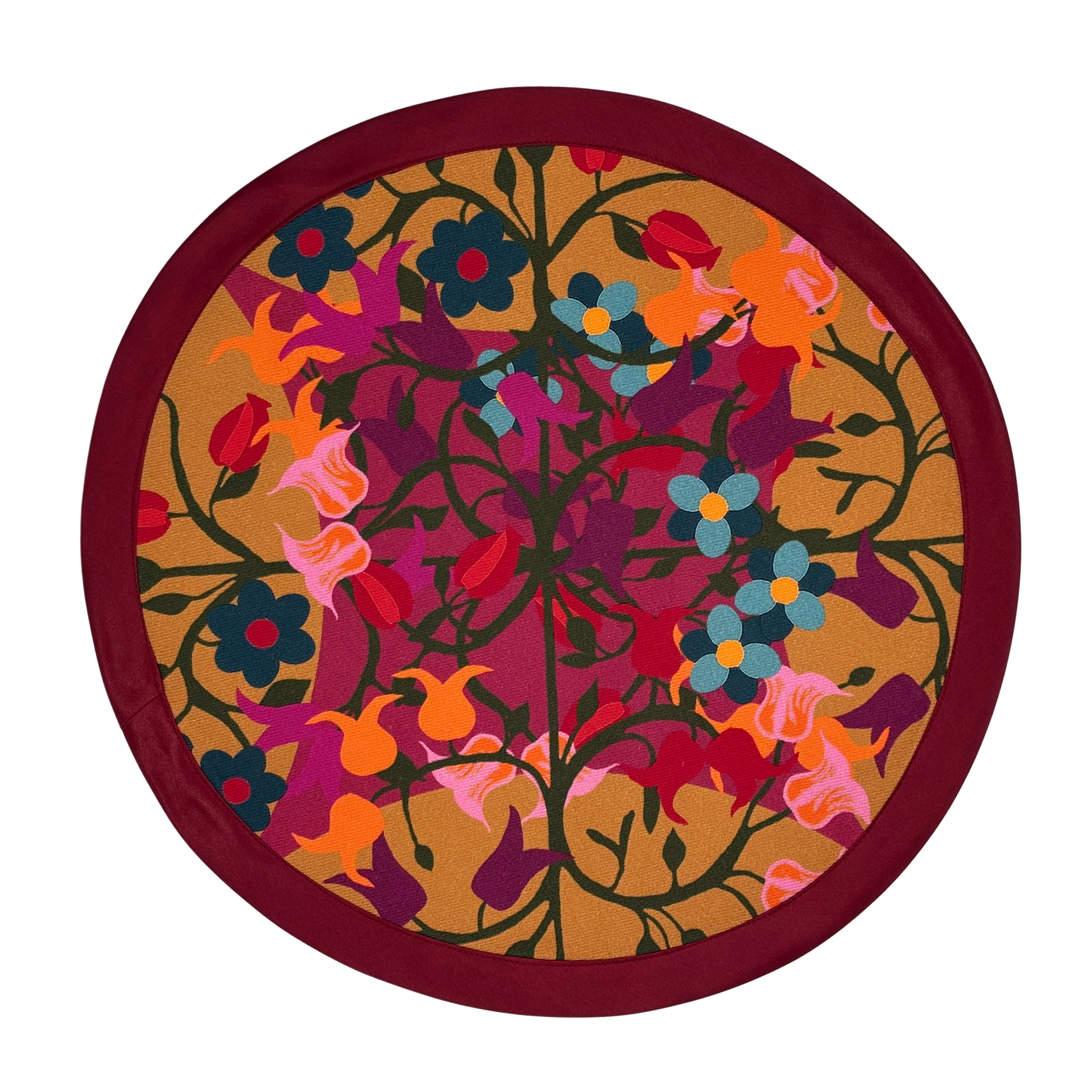 Round organic cotton placemat in orange and bordeaux floral geometric print.