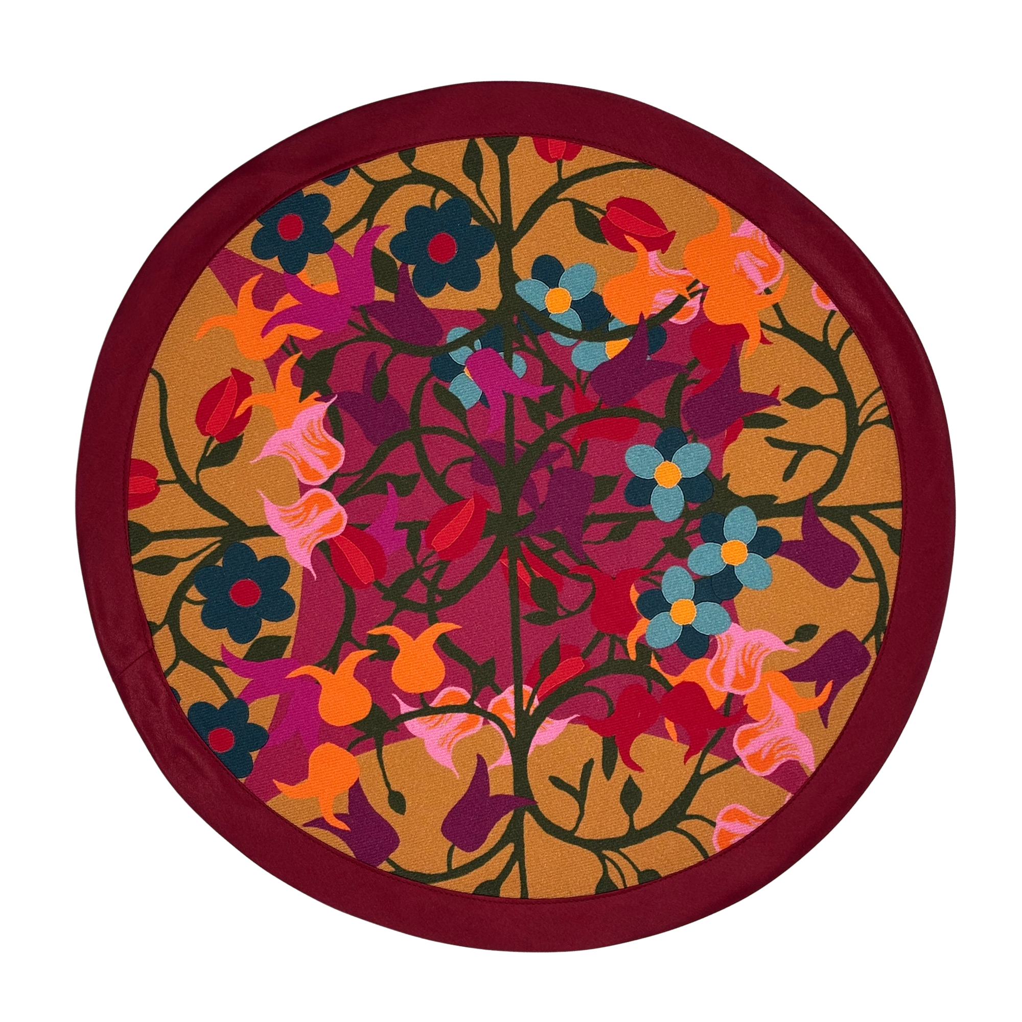 Round organic cotton placemat in orange and bordeaux floral geometric print.