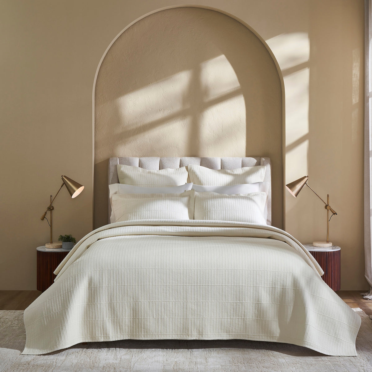 CL-271-9496_2|Luxurious cream textured coverlet with subtle grid pattern, draped elegantly on a bed, offering sophisticated comfort for modern bedrooms.