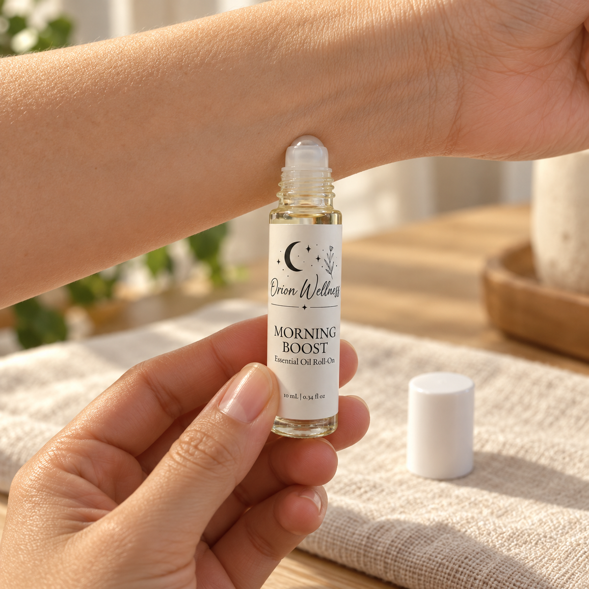 Morning Boost from the Orion Wellness Everyday five-piece roll-on set applied to the wrist