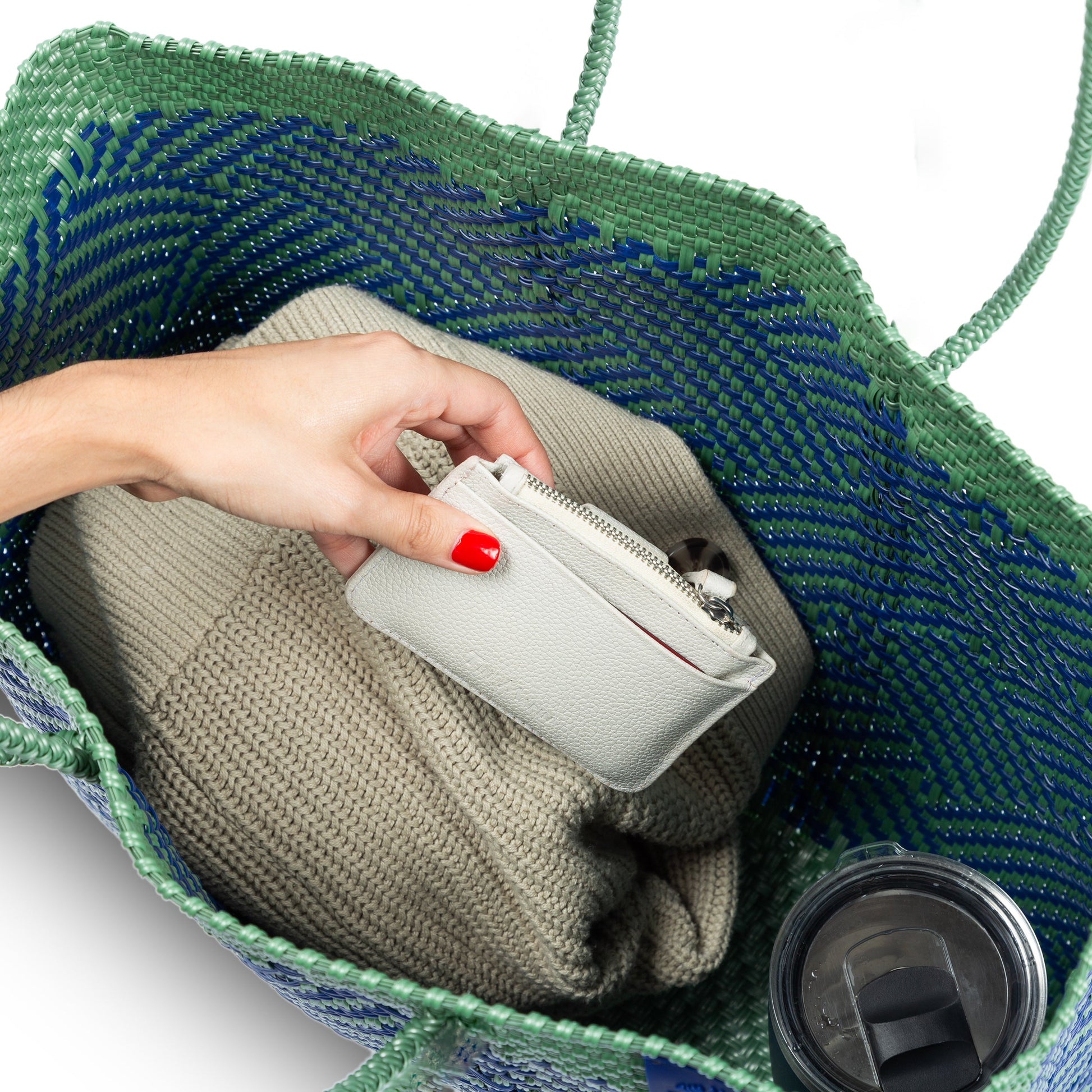 Interior of Tin Marin super tote in palmera Design, A blue and green geometric oversized tote bag with a shoulder strap.