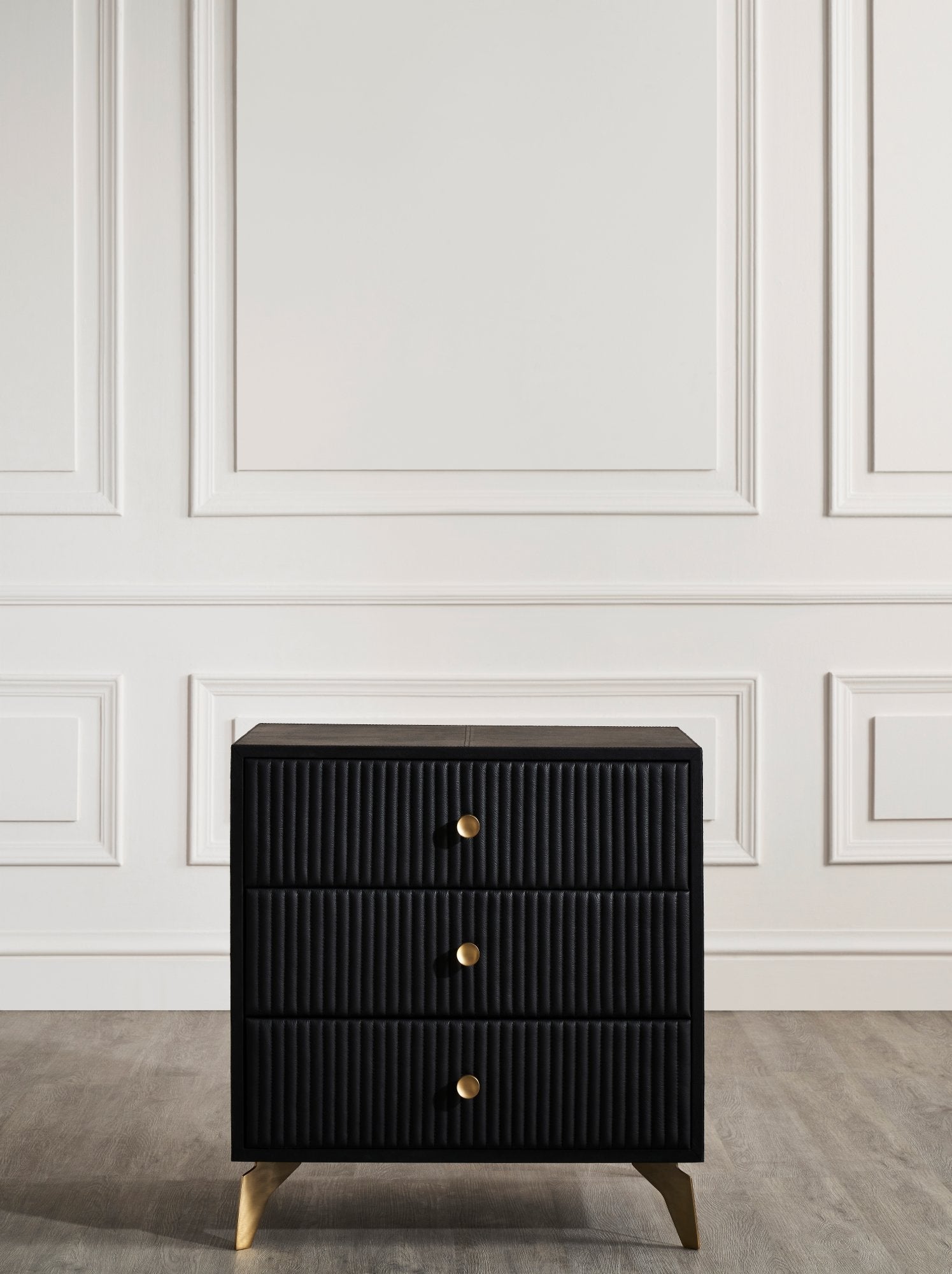 FN-5202-262028_3|Contemporary black leather 3-drawer nightstand, vertical channel tufting, stylish gold legs. Versatile leather furniture storage solution.