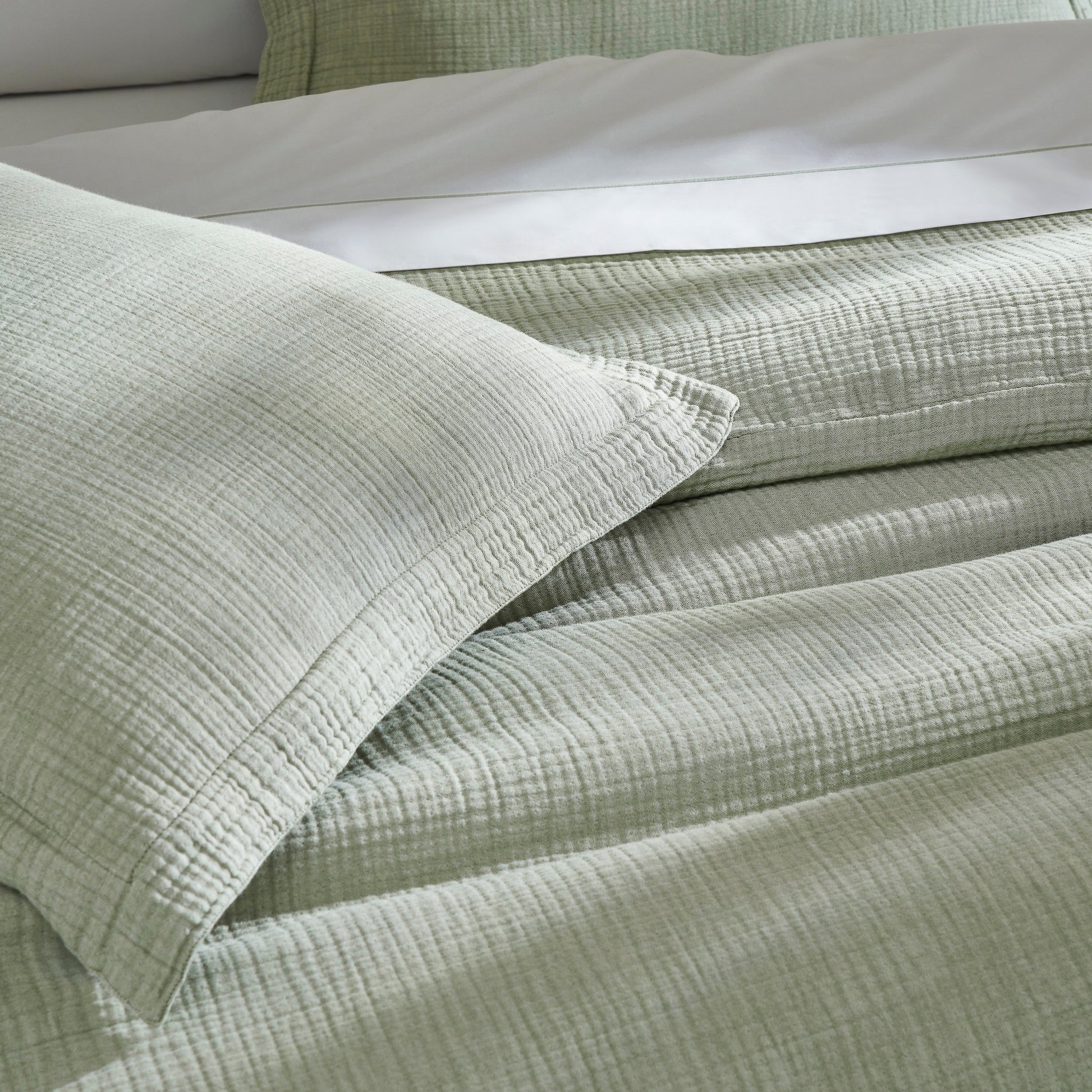 DT-051-9092_6|Close-up of the soft sage green textured cotton duvet cover fabric, highlighting its unique weave and comfortable texture.