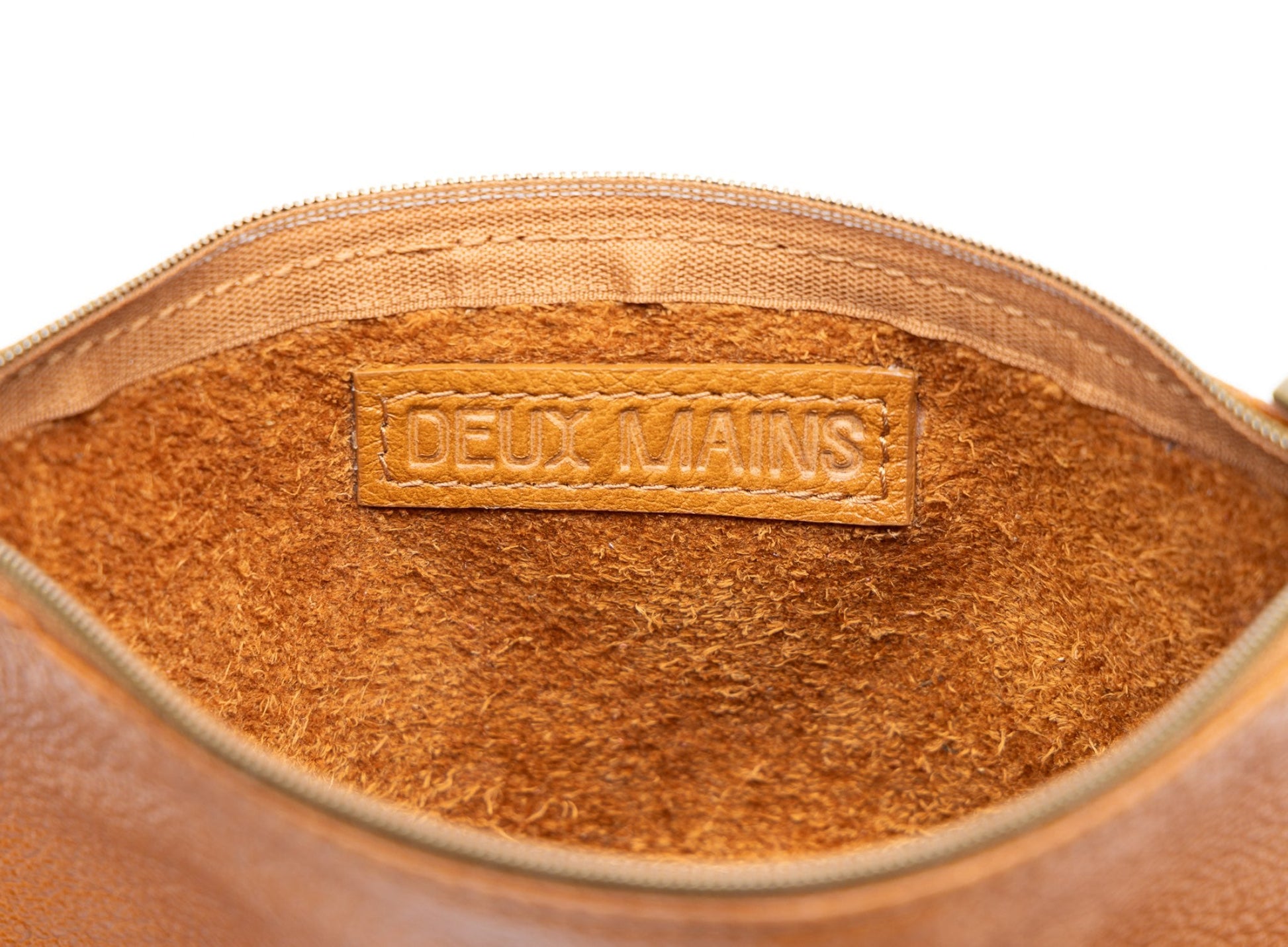 Deux Mains cognac leather pouch interior