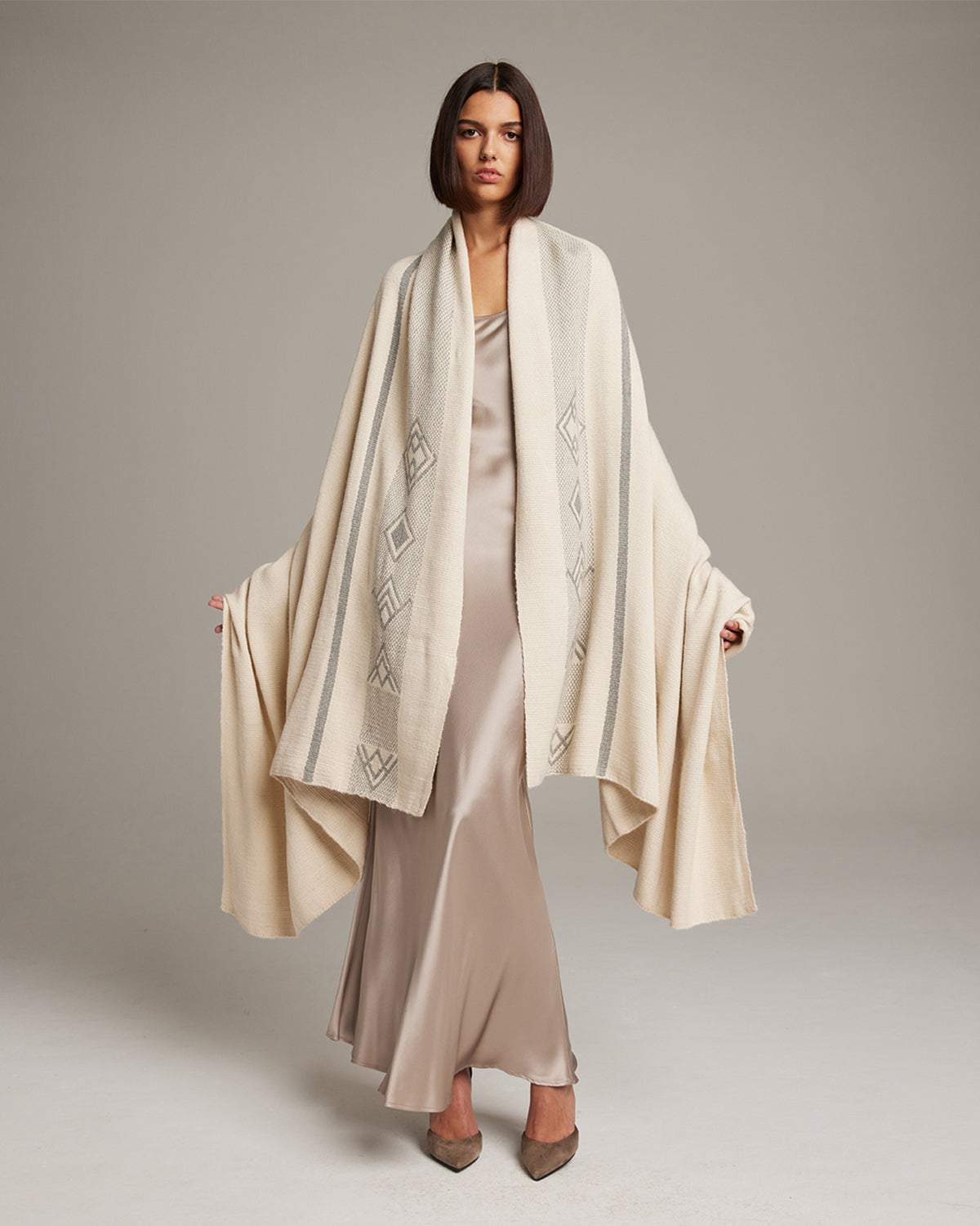 Model wearing a Wide Diagonal Alpaca Wrap, showcasing its design and texture.